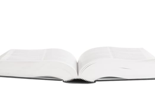 Large book open against white background.