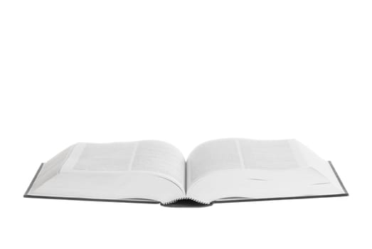 Large book open against white background.