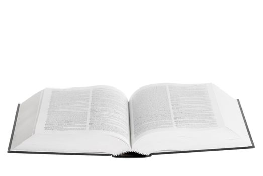 Large book open against white background.