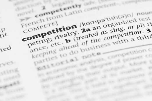 Macro image of dictionary word: Competition.