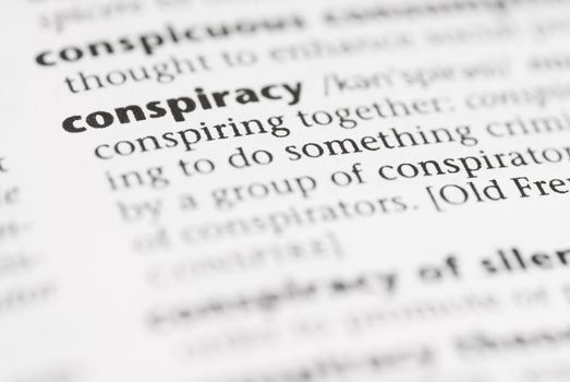 Macro image of dictionary word: Conspiracy.