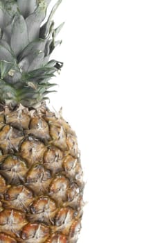 Whole pineapple set agains white background.