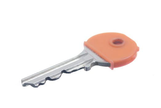 One orange house key, white background.