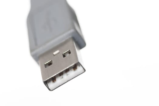 Macro image of one USB connector on white background.