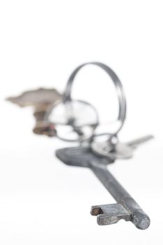 Set of keys on keyring. White background.