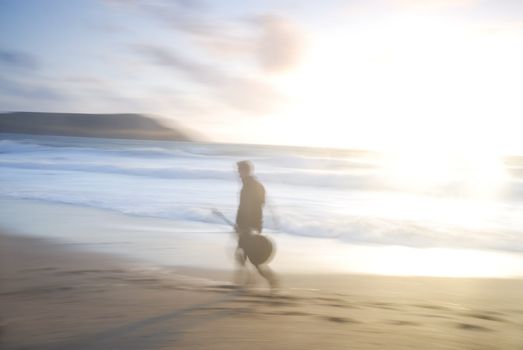 Motion blurred photo of man with guitar, UK.