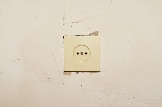 Plastic socket mounted in a concrete wall putty