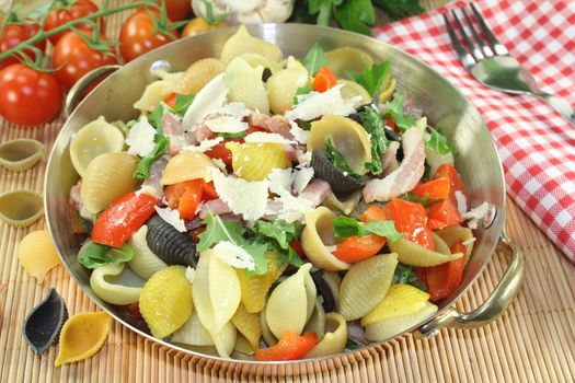 a noodle dish with vegetables and ham strips