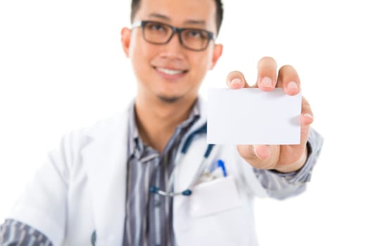 Southeast Asian medical male doctor showing his name card, isolated on white background