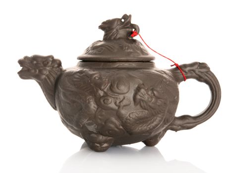 Chinese vintage teapot with dragon design isolated on white background