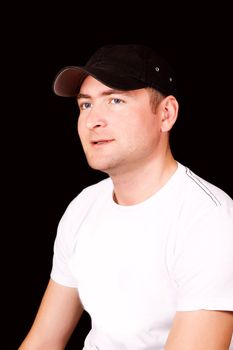 Serious Hispanic man wearing cap