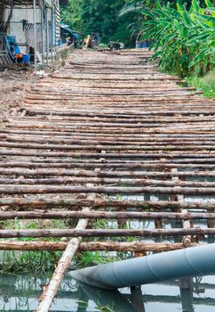 wooden bridge under construction in Thailand