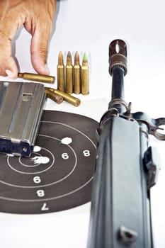 Close up of rifle and bullets on white background