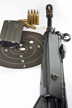 Close up of rifle and bullets on white background