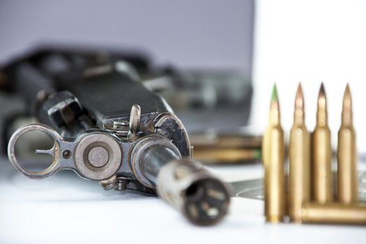 Close up of rifle and bullets on white background