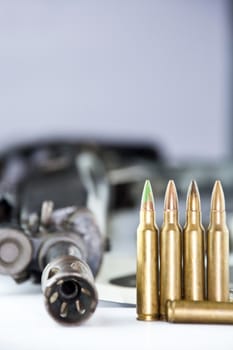 Close up of rifle and bullets on white background