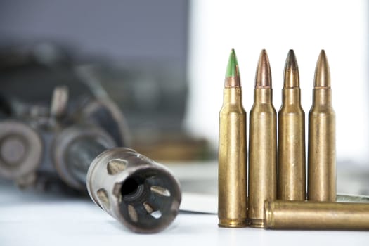 Close up of rifle and bullets on white background