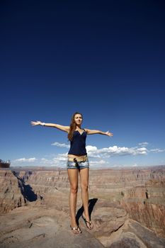 The beautiful young girl at the end of midday in the Grand Canyon Arizona