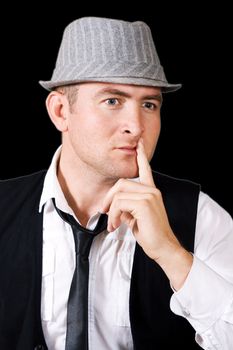 man in a cap isolated on a black background, is conceived