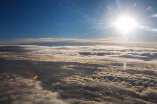 bright sun over the clouds - view from the plane 