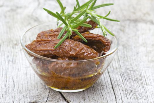 dried tomatoes with olive oil in a bowl 