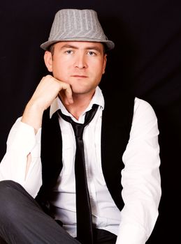 Portrait of young beautiful man in the hat