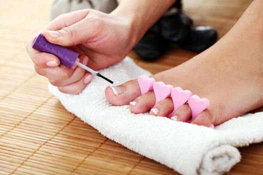 Image of SPA pedicure on bamboo surface