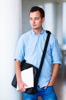 Handsome college student on campus (shallow DOF; color toned image)