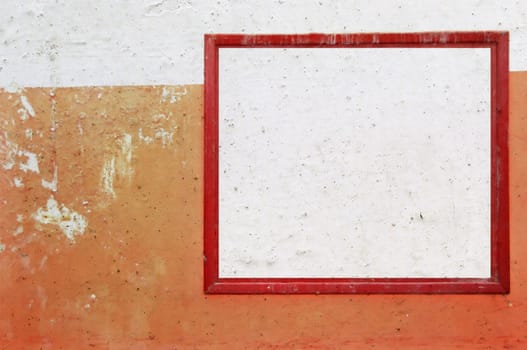 Red grunge frame on smudged peeling wall background. Abstract design element.