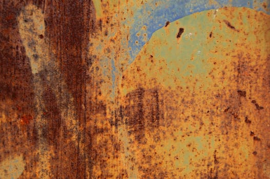 Rusty grunge metal background with paint stains. Abstract macro texture.