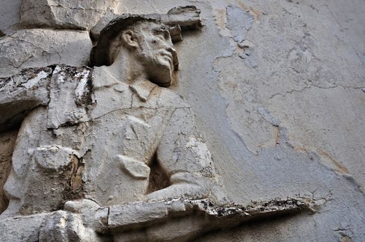 ATHENS - FEBRUARY 3: Entablature of soldier with broken bayonet on weathered wall exterior at the abandoned house of sculptor Nikolaos Pavlopoulos in Athens Greece, February 3, 2012.