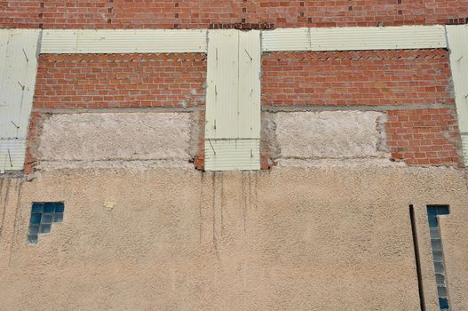Brick wall and insulation material background. Building under construction.