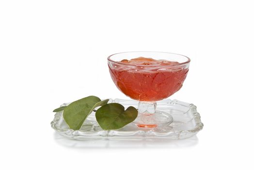 Still life with quinces and quince jelly in a glass cup