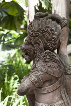 Traditional Balinese God statue in a Bali temple