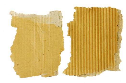 Torn cardboard pieces on a white background