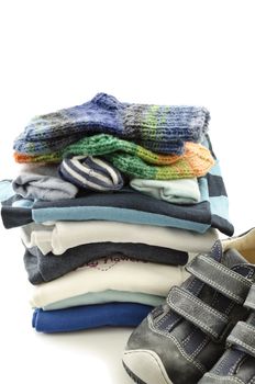 Baby boy clothes and shoes isolated on a white background.