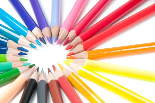 Shot of multicolored pencils in round shape isolated on white