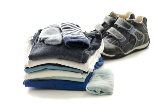 Baby clothes and shoes isolated on a white background.