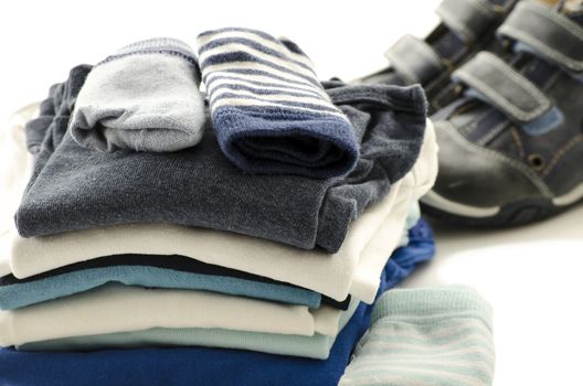 Baby boy clothes and shoes isolated on a white background.