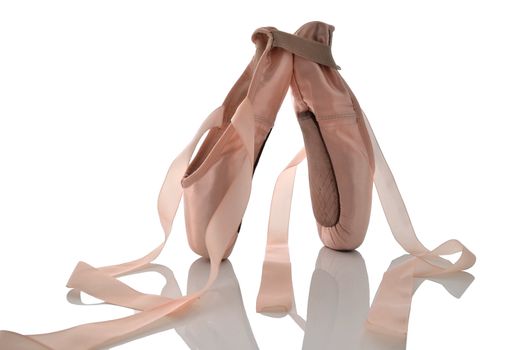 Ballet shoes on point isolated on a white background.