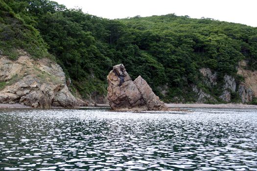 Rock at coast. Russia. Island Putjatin