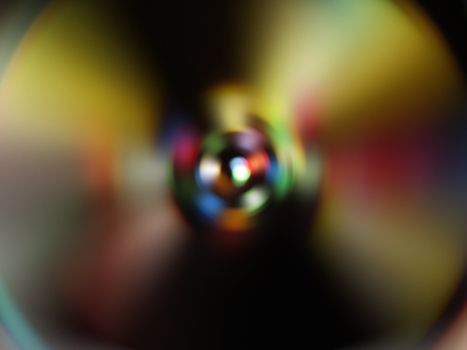 An abstract disco party background with subtle colors in the formation of a compact disc.