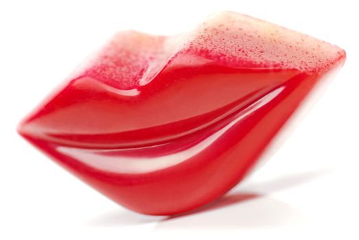 Red Lips shaped Praline on white background.