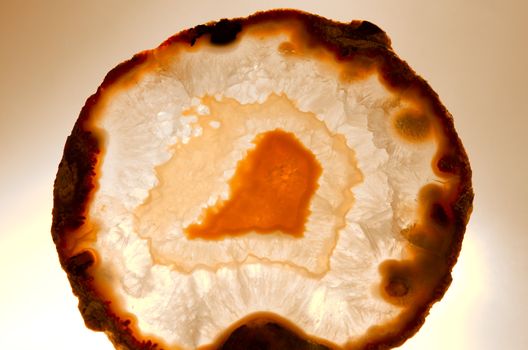 Close up of a thinly sliced backlit natural agate