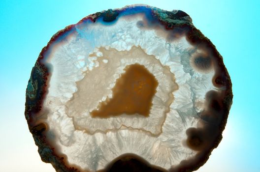 Close up of a thinly sliced backlit natural agate