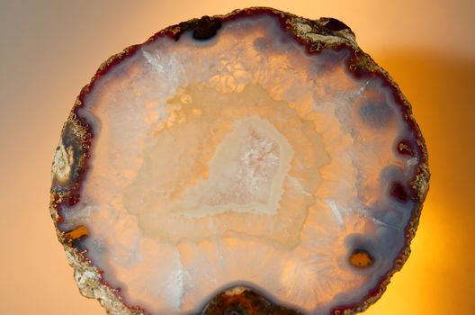 Close up of a thinly sliced backlit natural agate
