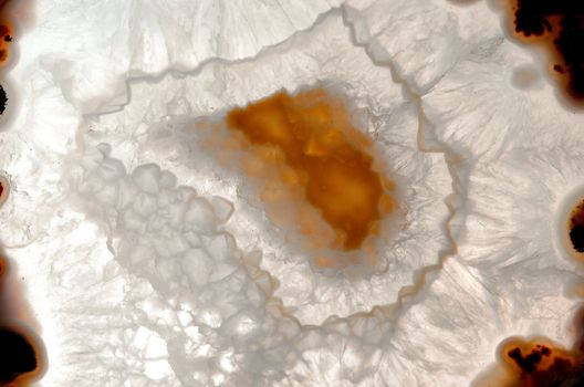 Close up of a thinly sliced backlit natural agate