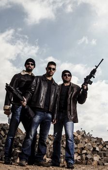 View of a group of gang members with guns.