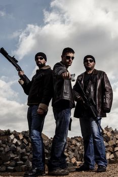 View of a group of gang members with guns.