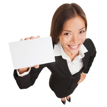 Business woman showing blank card sign. Businesswoman holding empty card with copy space smiling happy standing isolated on white background in full body length. Mixed race Asian Chinese / Caucasian.